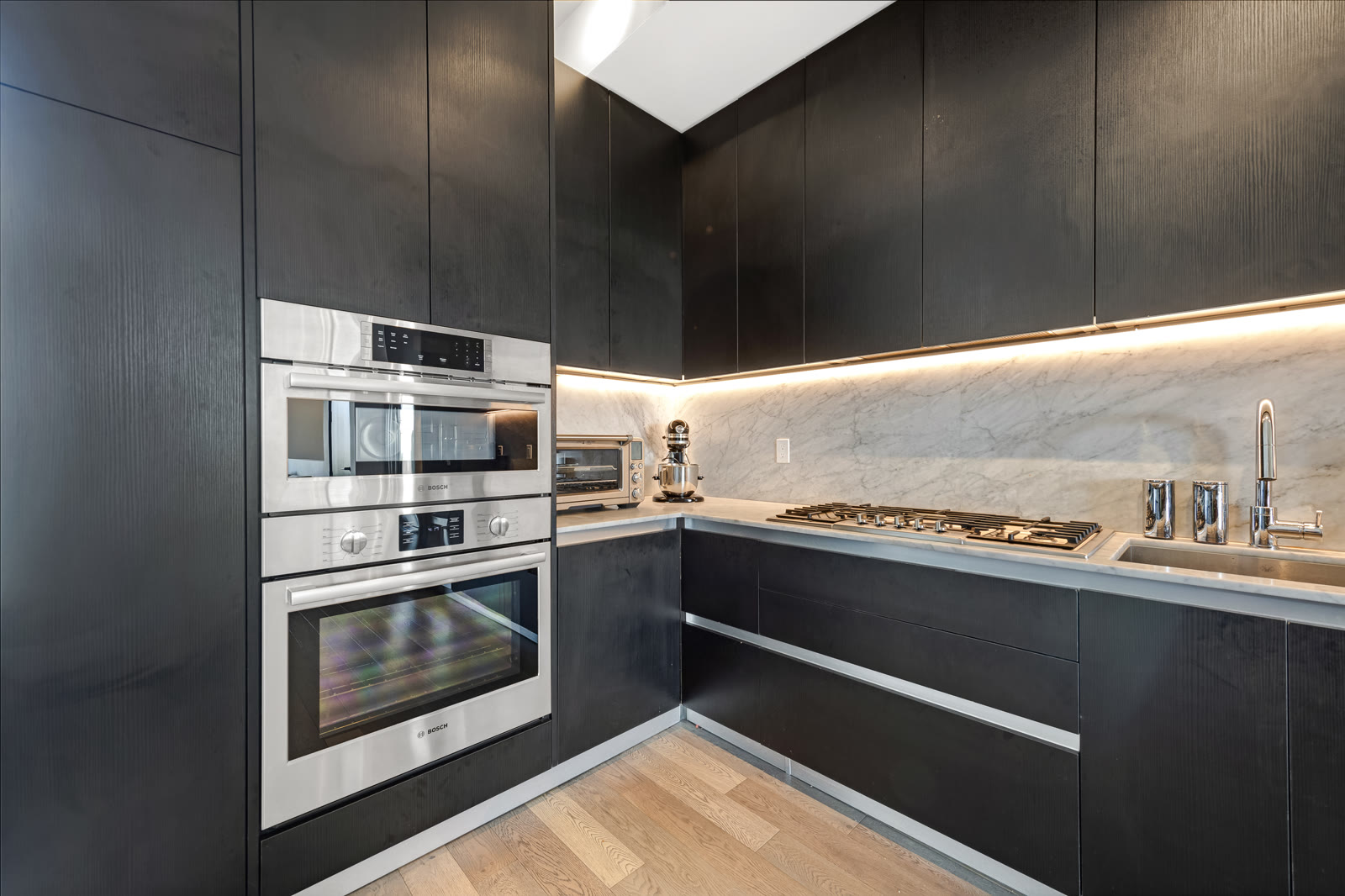 Sleek chef's kitchen with integrated appliances